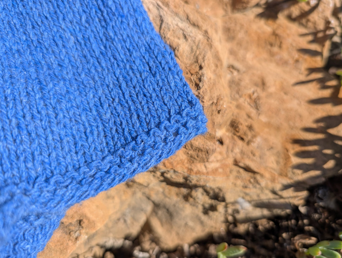 Detail of the cuff edge on a blue Jaipur wrist warmer