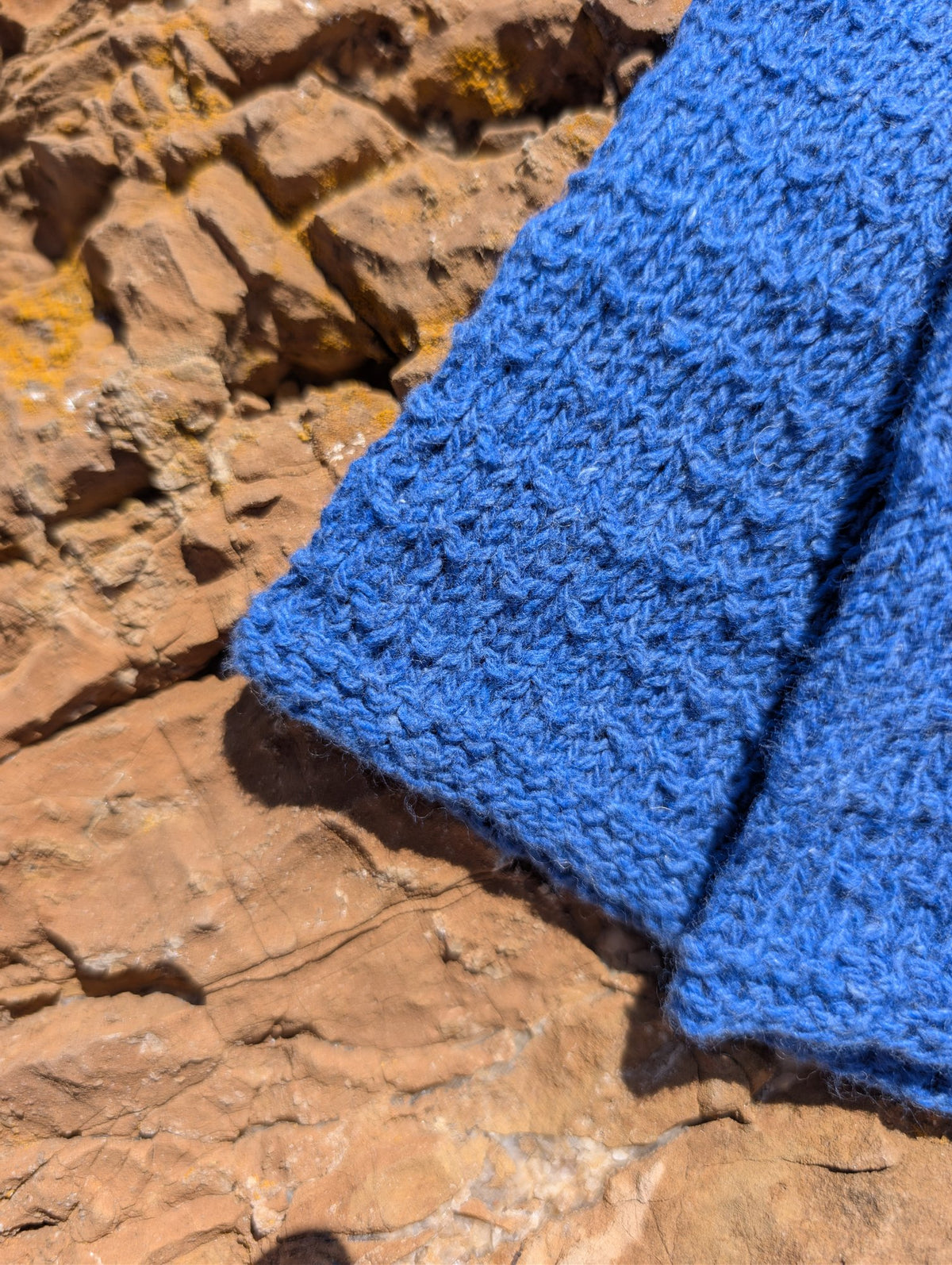 Close-up of the knit and purl texture on the Jaipur wrist warmers