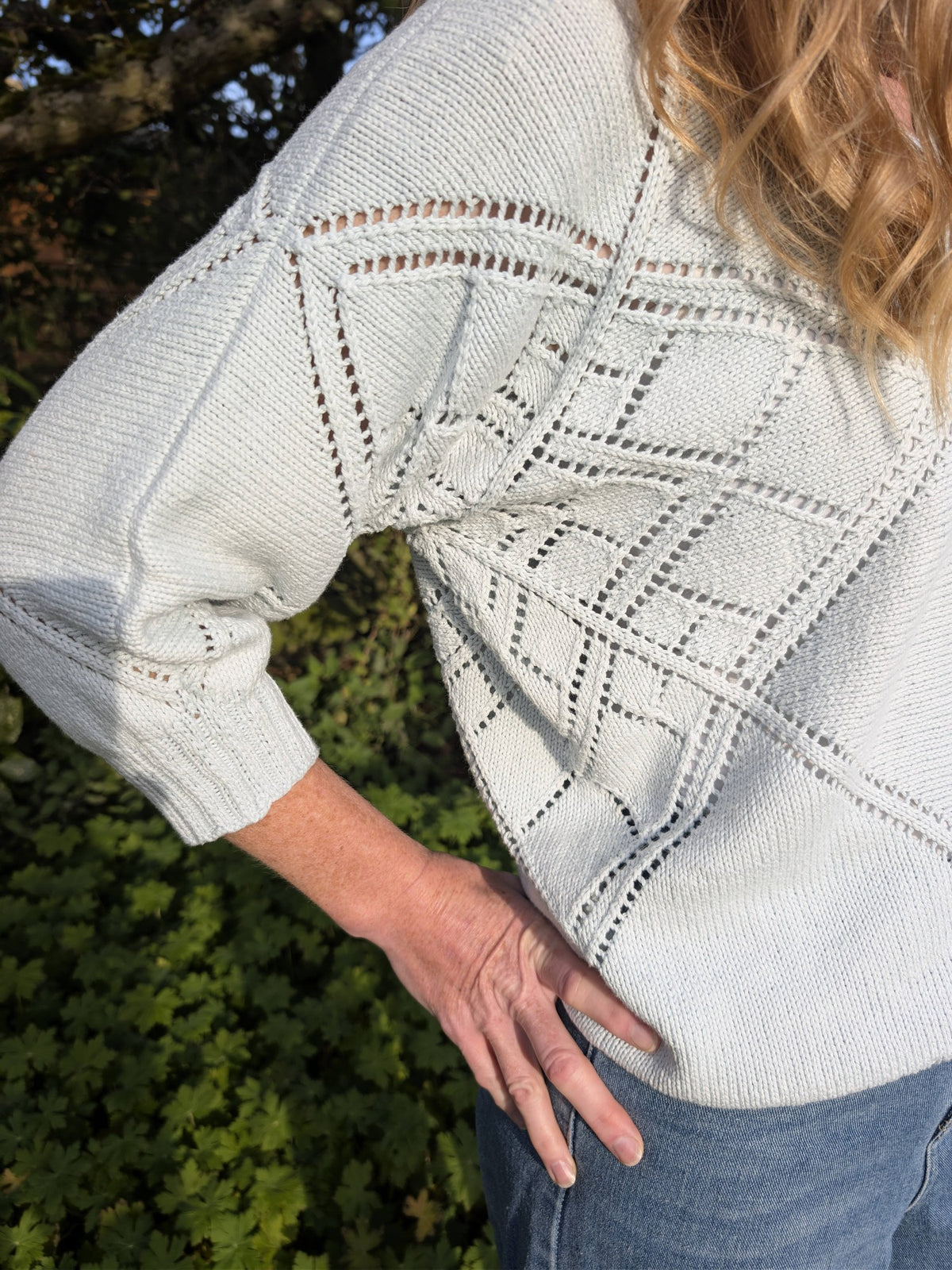 Close-up of the Tessera lace on the sleeve above the ribbed cuff